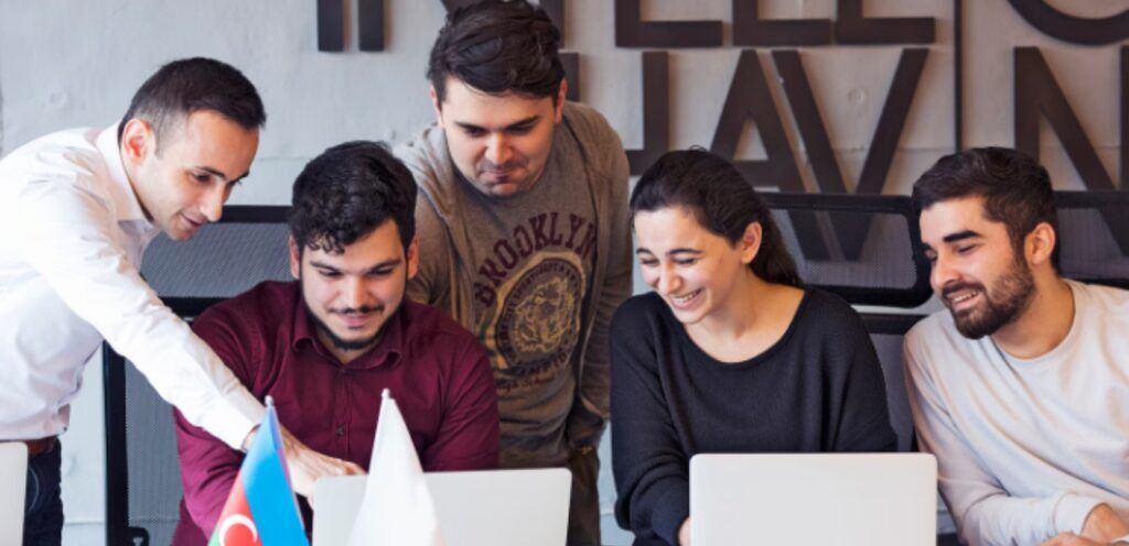 A team photo of DHA’s social media experts working collaboratively.